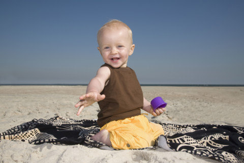 Baby boy playing at beach. Date : 2008
