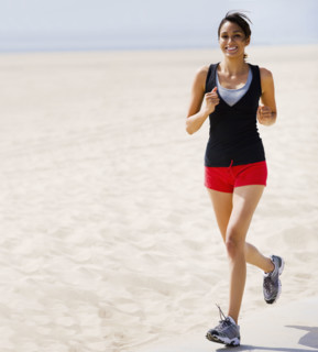 Woman running on beach. Date : 2008