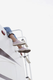 Girl sitting on top of motor home. Date : 2008