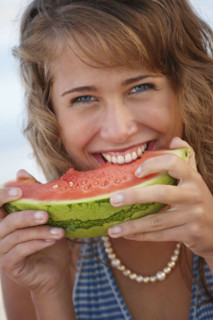 Young woman eating watermelon. Date : 2008