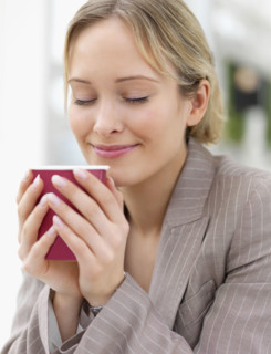 Businesswoman enjoying coffee. Date : 2008