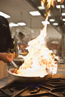 Chef cooking with flame. Date : 2008