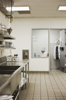 Chef sitting in kitchen office. Date : 2008