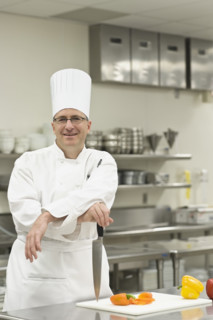Chef posing in kitchen. Date : 2008