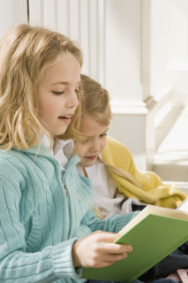 Sisters reading on porch. Date : 2008