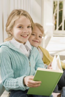 Sisters reading on porch. Date : 2008