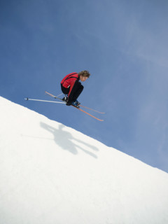 Skier jumping off lip of half-pipe. Date : 2008