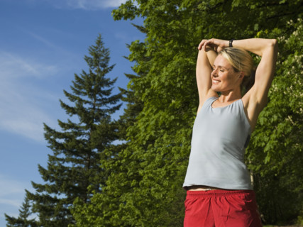 Runner stretching on rocky trail. Date : 2008