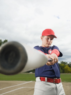 Baseball player swinging bat. Date : 2008