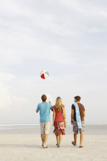Friends walking on beach. Date : 2008