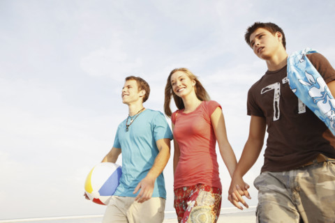 Friends walking on beach. Date : 2008