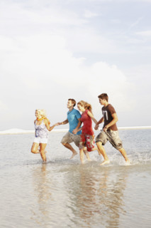 Friends running in ocean. Date : 2008