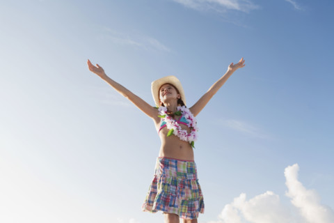 Girl in bathing suit with lei around neck. Date : 2008