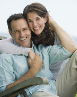 Portrait of couple hugging.