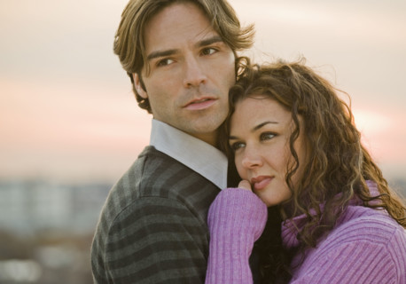 Portrait of couple hugging.