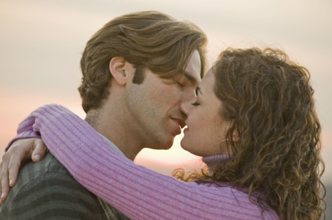 Close up of couple kissing.