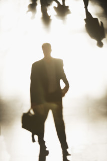 Silhouette of businessman holding briefcase. Date : 2008