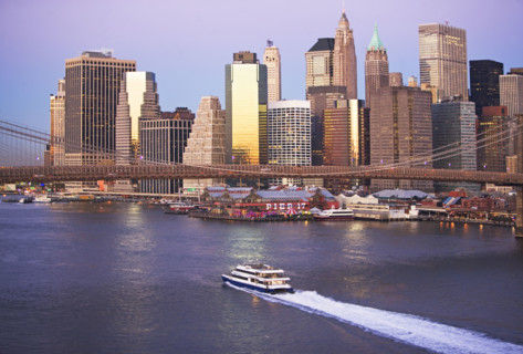 Boat passing under Brooklyn Bridge. Date: 2008
