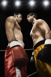 Boxers facing off in boxing ring. Date : 2008