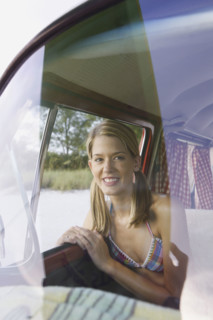 Woman sitting in passenger seat of van. Date: 2008