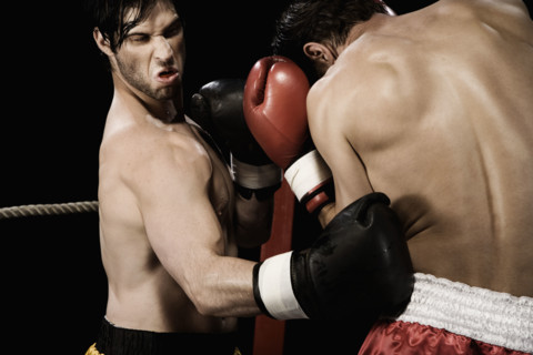 Boxers fighting in boxing ring. Date : 2008