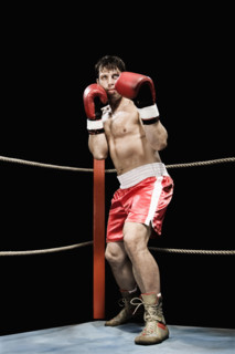 Boxer standing in fighting stance in boxing ring. Date : 2008