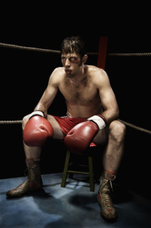 Boxer sitting on stool in corner of boxing ring. Date : 2008