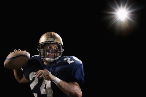 Quarterback throwing football. Date: 2008
