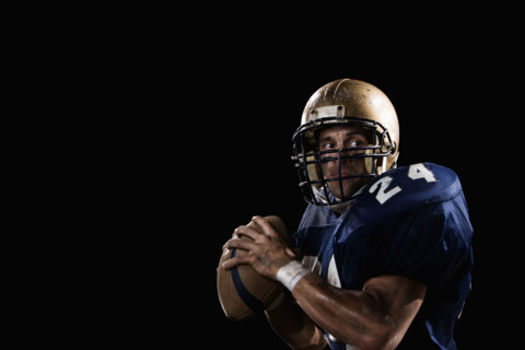 Quarterback preparing to throw football. Date: 2008