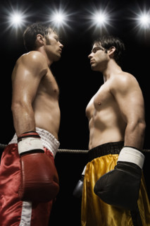 Boxers facing off in boxing ring. Date : 2008