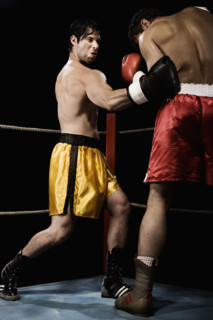 Boxers fighting in boxing ring. Date : 2008