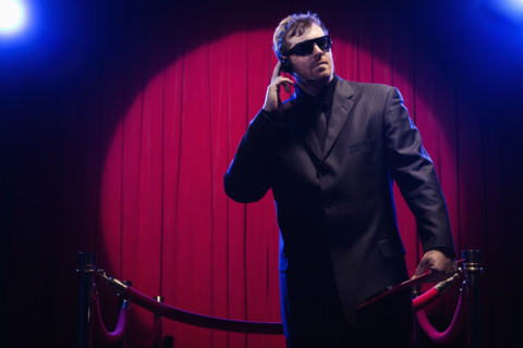 Bouncer listening to headset. Date: 2008