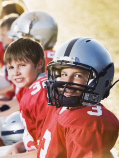 Football players sitting on bench. Date : 2008