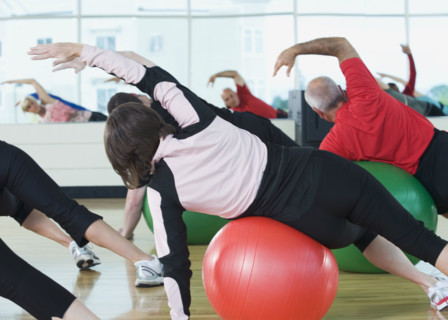 Fitness class stretching on balance balls. Date : 2008