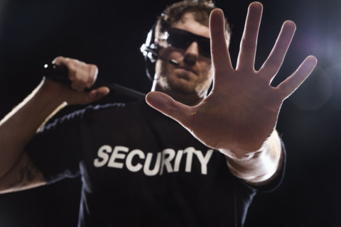 Security guard extending hand. Date : 2008