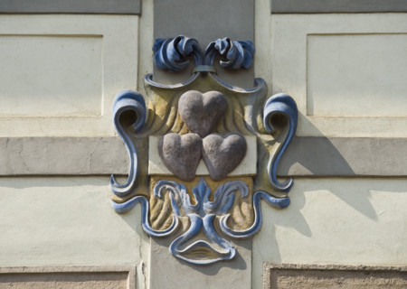 Close up of heart emblem on house.