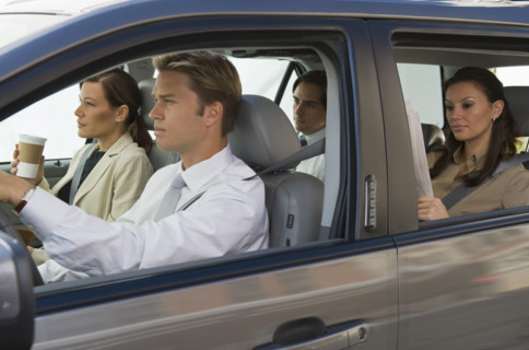 Business people car pooling.
