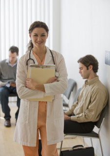 Female doctor posing in waiting room.