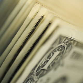 Close up of one dollar bills.