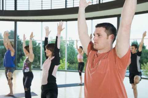 Yoga class in mountain pose. Date : 2008