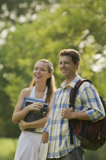 College students with books and backpack. Date : 2008