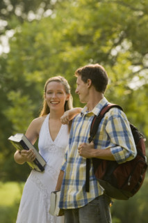 Portrait of college students with books and backpack. Date : 2008