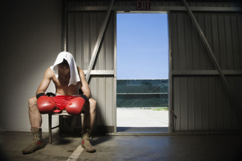 Boxer sitting on stool near doorway. Date : 2008