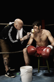Coach talking to boxer in corner of boxing ring. Date : 2008