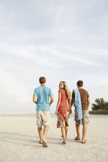 Friends walking on beach. Date : 2008