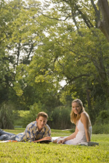 Portrait of college students studying in grass. Date : 2008