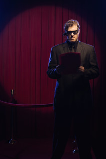 Bouncer looking at guest list. Date: 2008