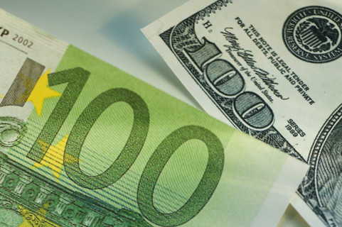 One hundred dollar bill and one hundred euro bill.