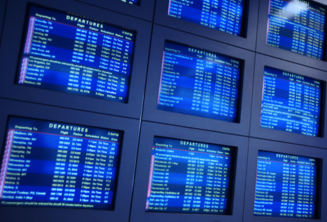 Airport arrival and departure information monitors.