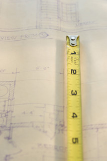 Tape measure on blueprint.
